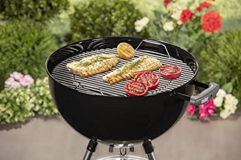 grilling meat and vegetables on a Bar-B-Kettle Charcoal Barbecue