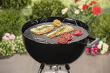 grilling meat and vegetables on a Bar-B-Kettle Charcoal Barbecue