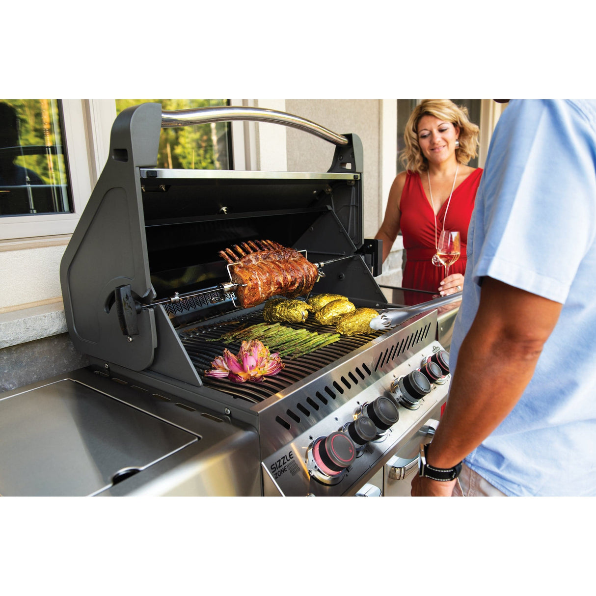 couple grilling food on Napoleon Prestige 500 RSIB