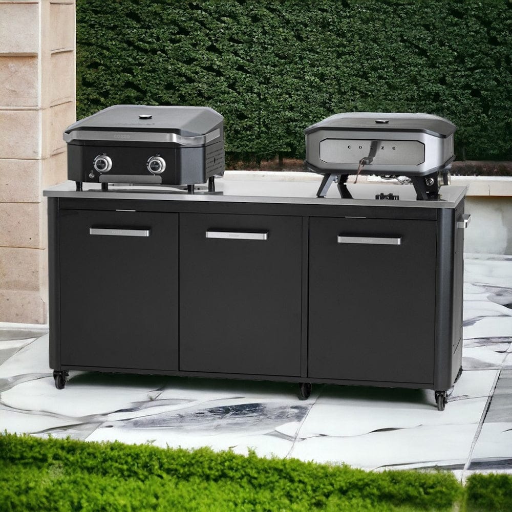 front of the Cozze Outdoor Kitchen 3 Door Unit with a grill and pizza grill on it outdoors