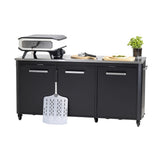 front of the Cozze Outdoor Kitchen 3 Door Unit with a pizza grill, cutting boaard, pizza cutter and holder on it