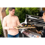 people grilling on Napoleon Prestige PRO 665 RSIB