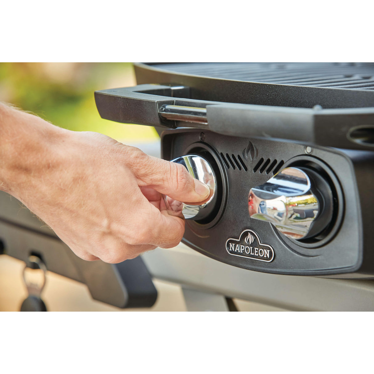 adjusting Napoleon Portable Gas Grill with Scissor Cart