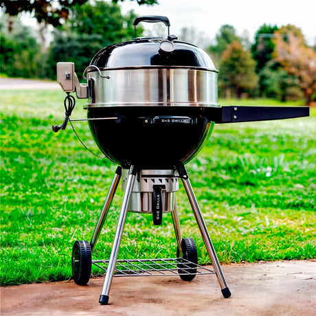 Full view of a Slow 'N Sear® Kettle Ring Rotisserie Kit placed on top of a kettle grill with its lid closed.
