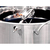 Close-up view of a Slow 'N Sear® Kettle Ring Rotisserie Kit placed on top of a smoking kettle grill.