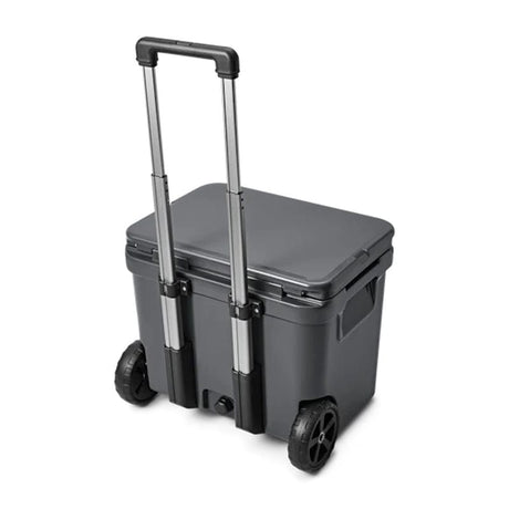 back side of a Charcoal  YETI Roadie - 60 Wheeled Cool Box shown with periscopic handle