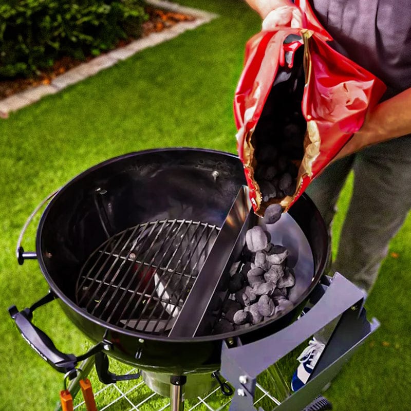 pouring charcoal into slow n sear deluxe 