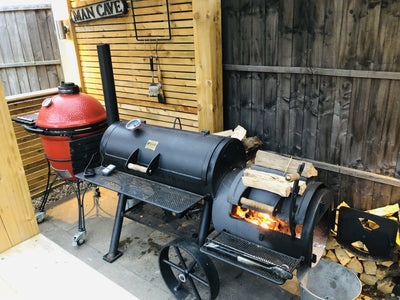 BBQ Offset Smoker Burning Wood in the Man Cave