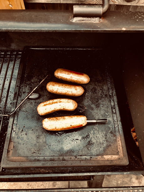 Sausages Cooked on BBQ Lave Stone Plate