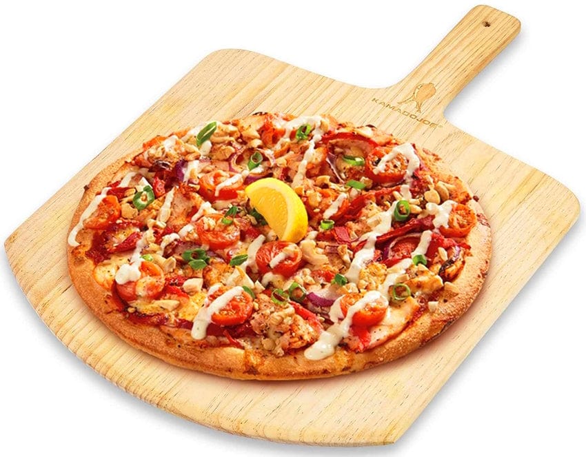 A cooked pizza served using a kamado joe pizza peel