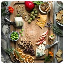 food on PK Grills Teak Cutting Board