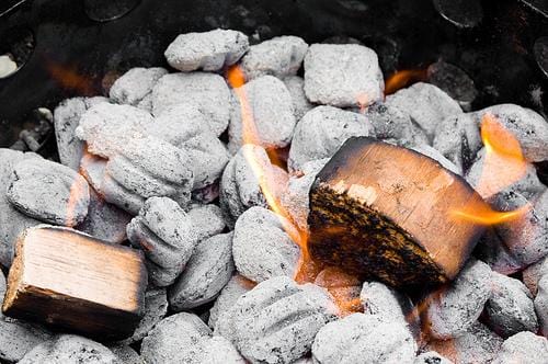 BBQ Smoking Wood Chunks on Coal Fire